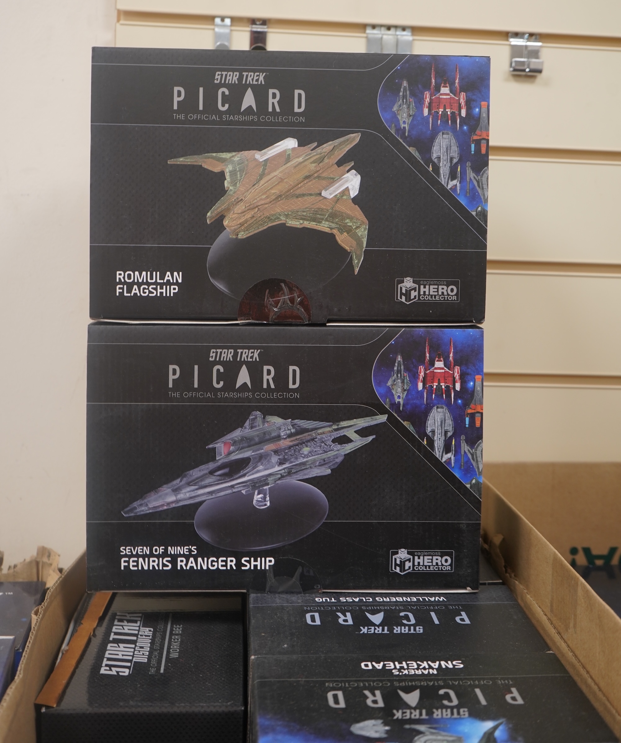Eighteen boxed Eaglemoss Star Trek magazine issue models, including; a Vulcan Cruiser, a Klingon Qugh Class vessel, a Son’a Battleship, a Romulan Flagship, Jupiter Station, Ty’Gokor Orbital Station, etc. Condition - good